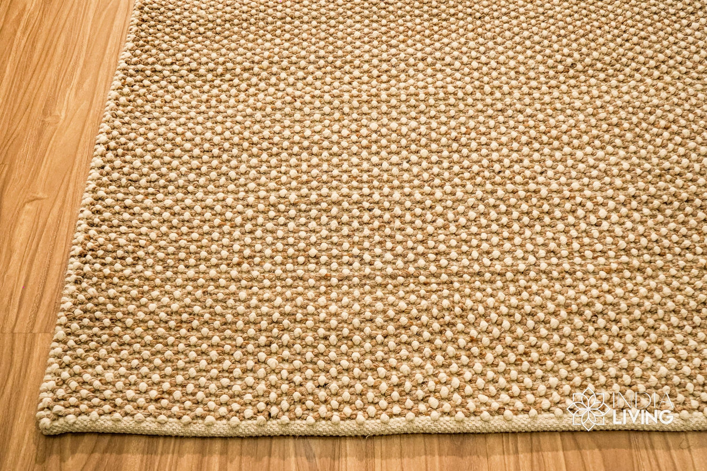 Beige chunky looped wool rug, full flat view