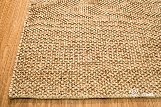 Beige chunky looped wool rug, full flat view