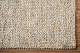 Overhead view of taupe grey chunky wool rug on flooring