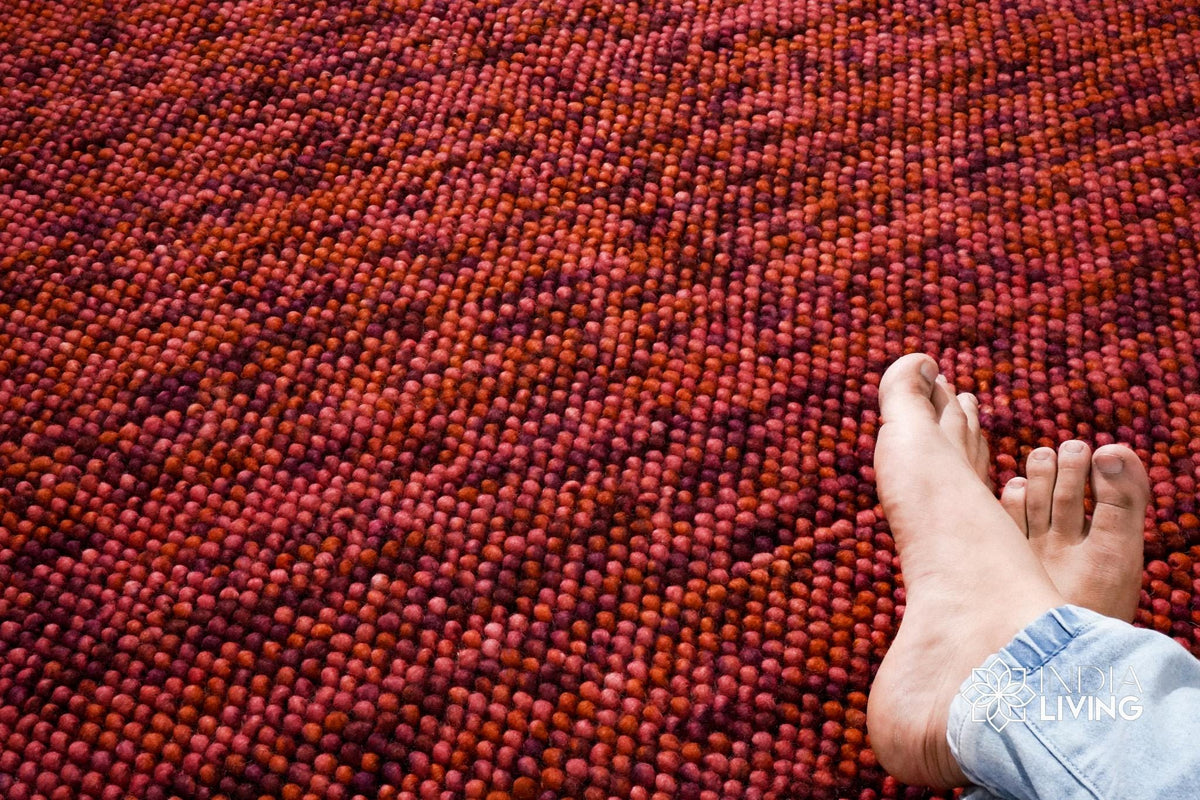 Terracotta wool rug in a bedroom decor setting