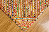 Hand braided rainbow rug in a modern boho living space