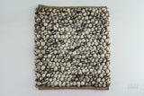 Ivory brown chunky pebble wool rug, flat lay view