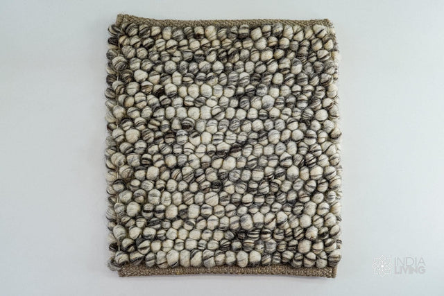 Ivory brown chunky pebble wool rug, flat lay view