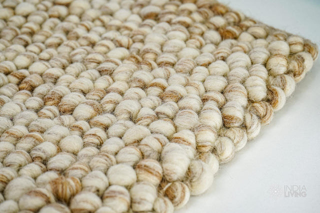 Natural beige chunky pebble loop wool rug, flat lay view