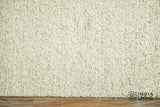 Light beige wool rug in a neutral room styling