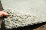 Beige wool rug texture close-up detail