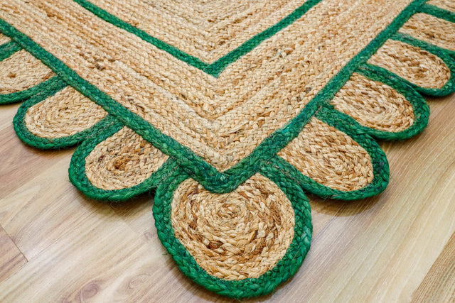 Green scallop hand braided jute rug, full flat view
