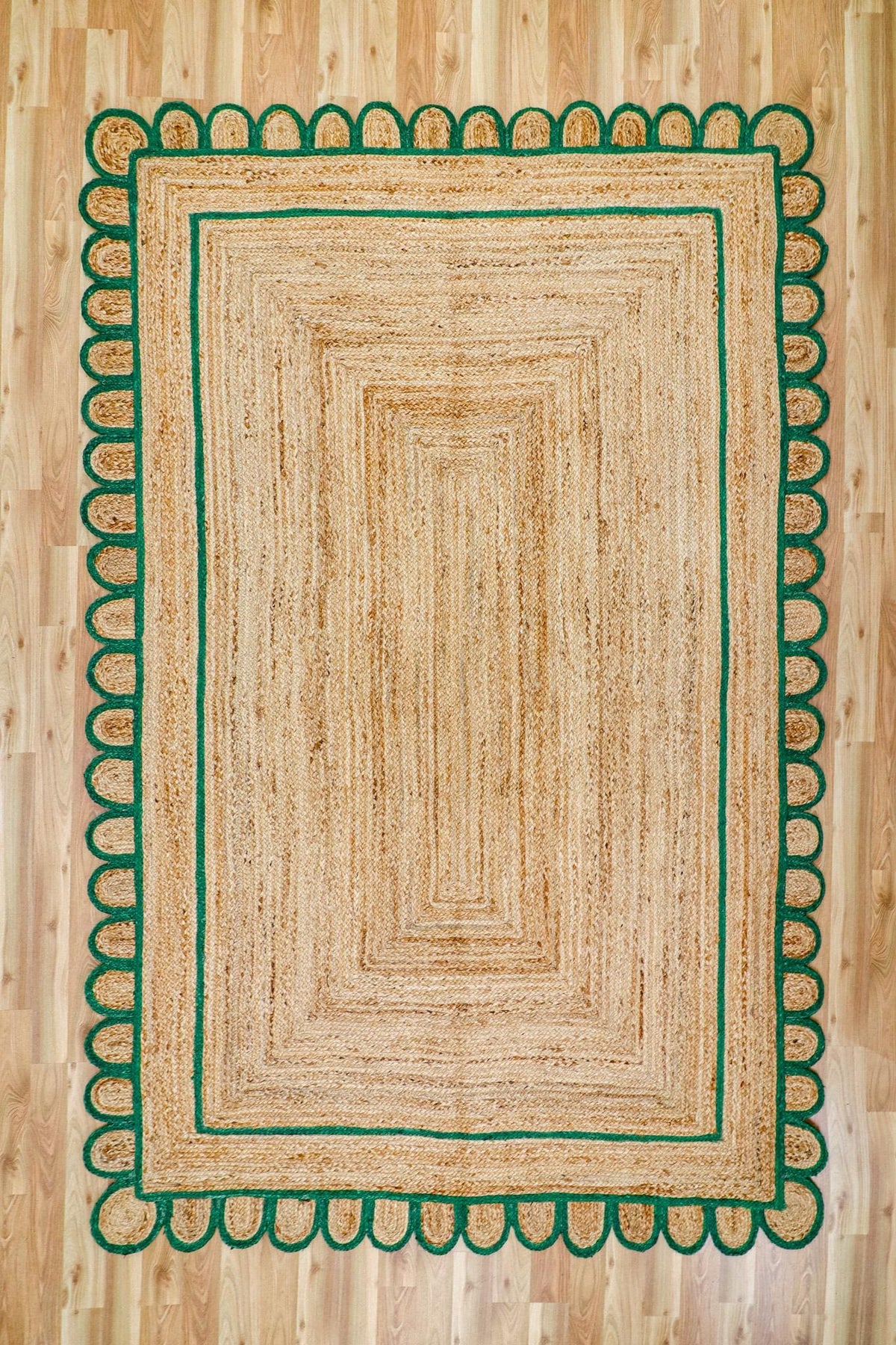 Close-up of scalloped edge on hand braided jute rug