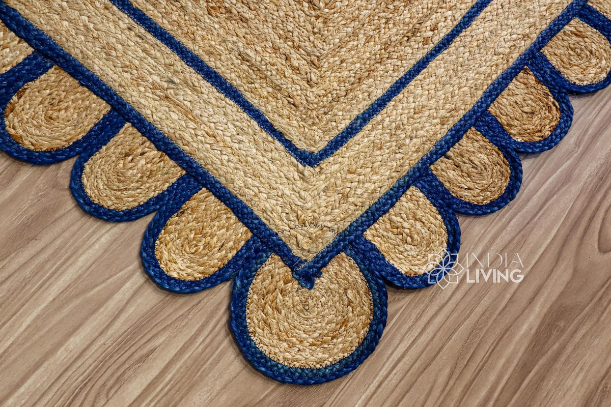 Navy blue jute rug corner detail showing braided texture