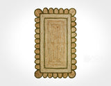 Close-up of scalloped edge on olive green jute rug