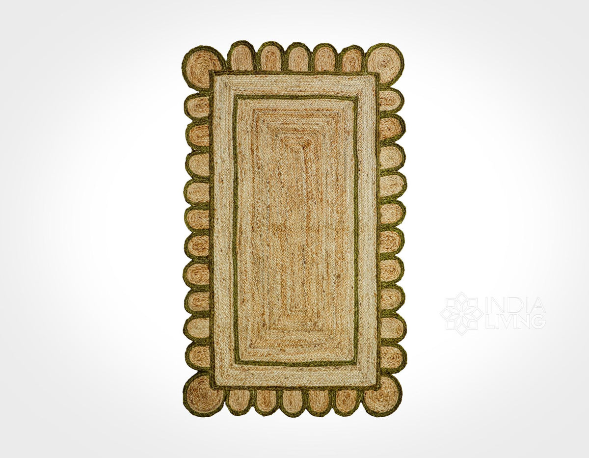 Close-up of scalloped edge on olive green jute rug