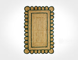 Dark green jute rug corner detail showing braided texture