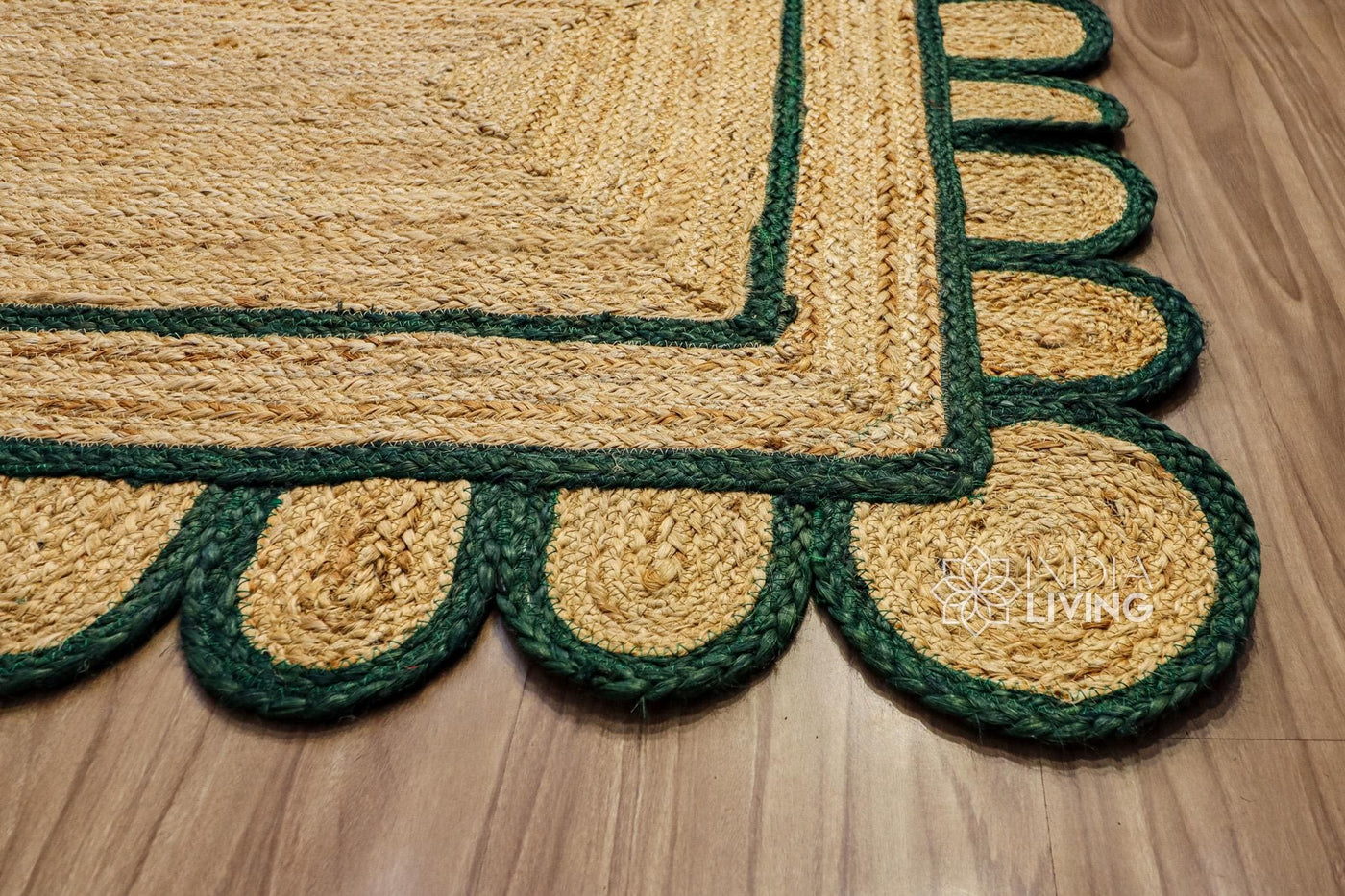 Dark green scalloped hand braided jute rug, full flat view
