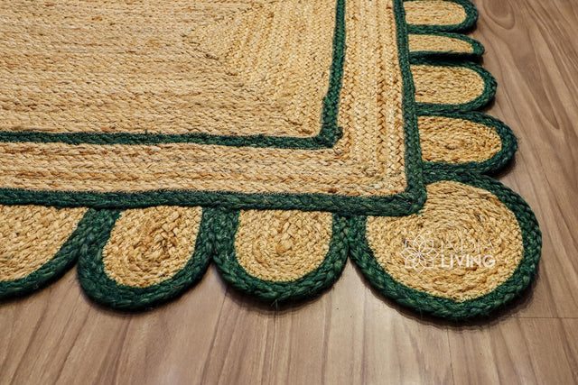 Dark green scalloped hand braided jute rug, full flat view