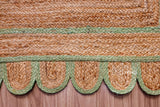 Pistachio green jute runner in an entryway styled with décor