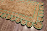 Pistachio green scalloped jute runner laid flat, full view