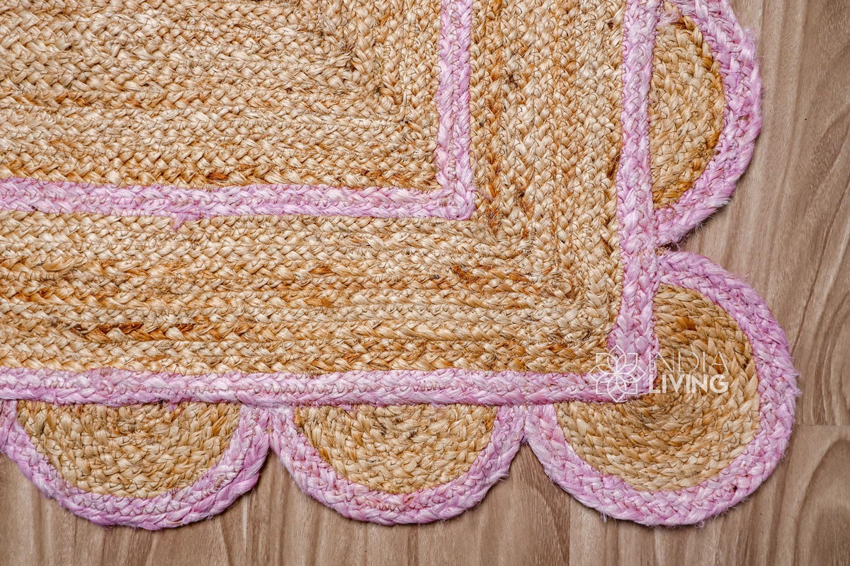 Overhead view of light pink jute runner on wood flooring