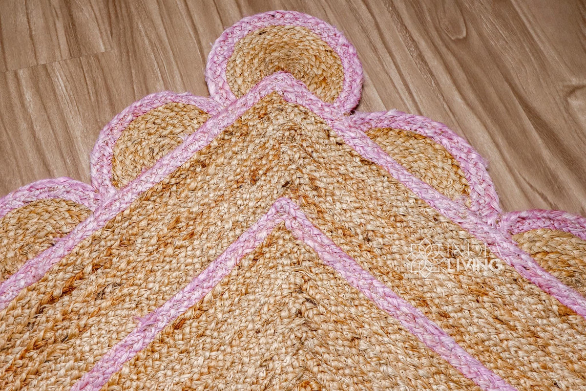 Light pink jute runner edge close-up highlighting scallop stitching