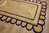 Corner view of purple jute runner showing braided weave