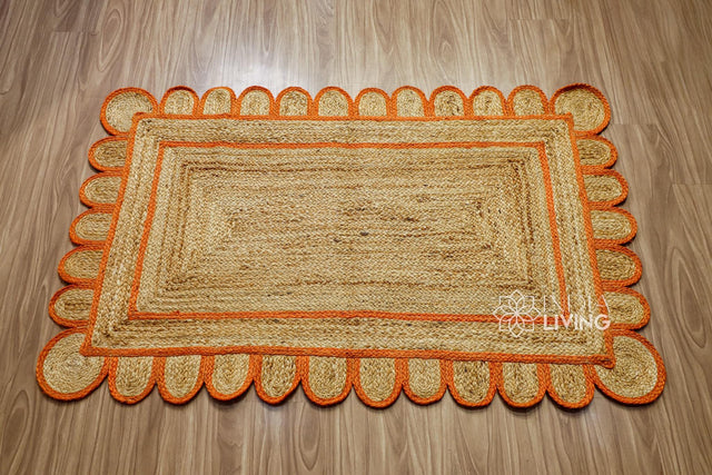 Orange scallop edge jute rug, flat lay view