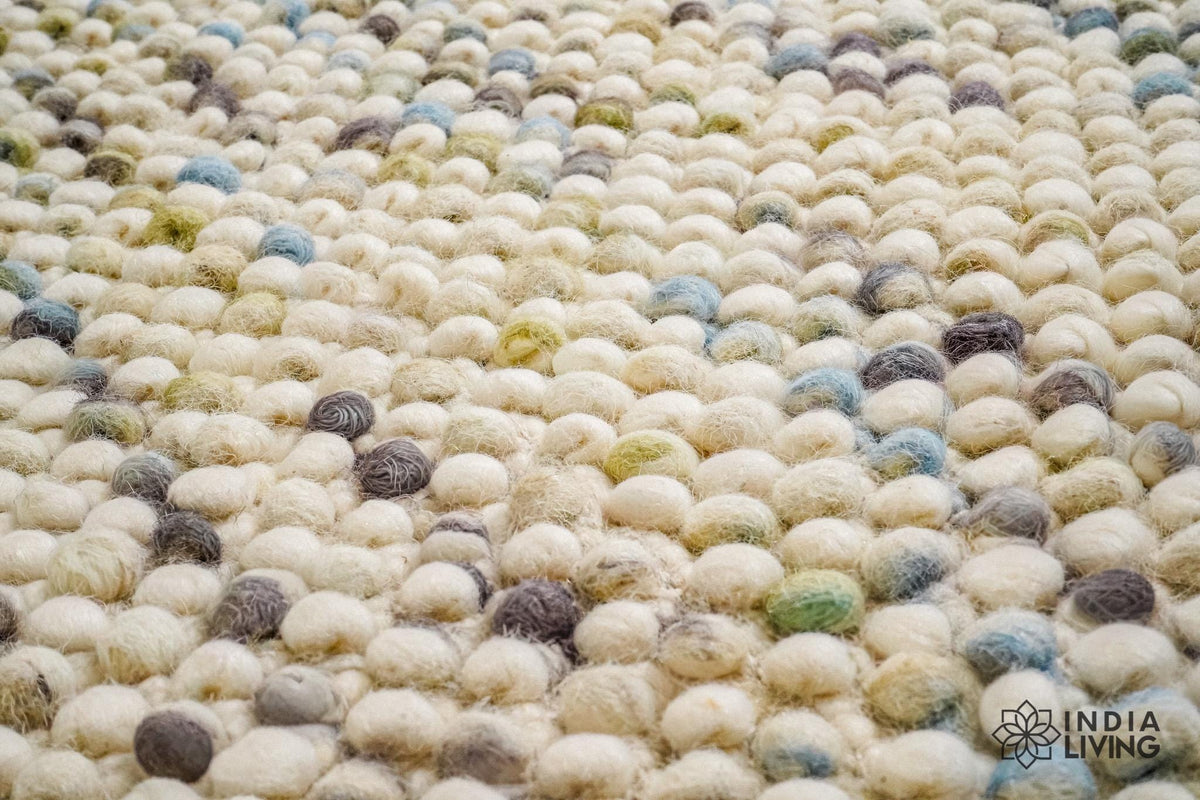 Close-up of chunky wool loop texture in pastel shades