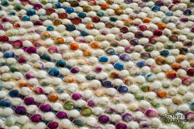 Multicolour chunky wool rug styled in a bright living room