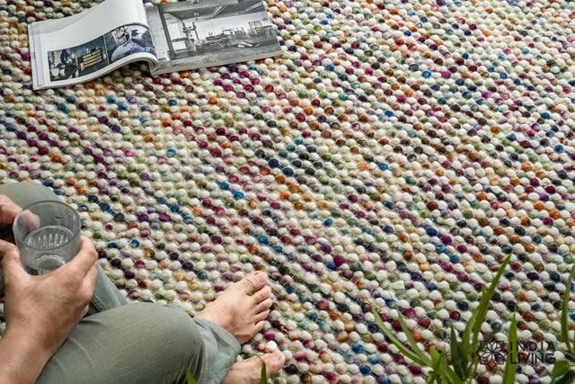 Colourful chunky wool loop rug handwoven in multicolour, full flat view
