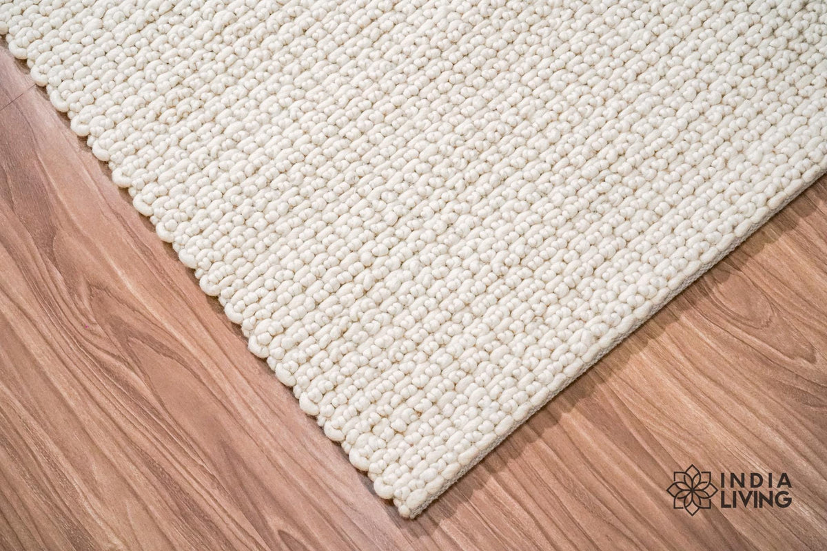 Close-up of ivory chunky looped wool texture