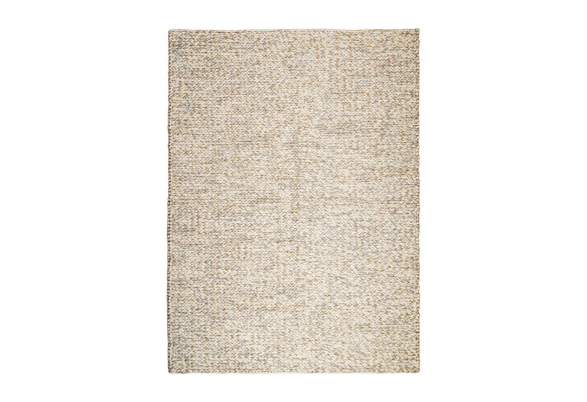 Corner view of taupe grey chunky wool rug showing thickness