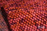 Terracotta wool rug edge and border detail