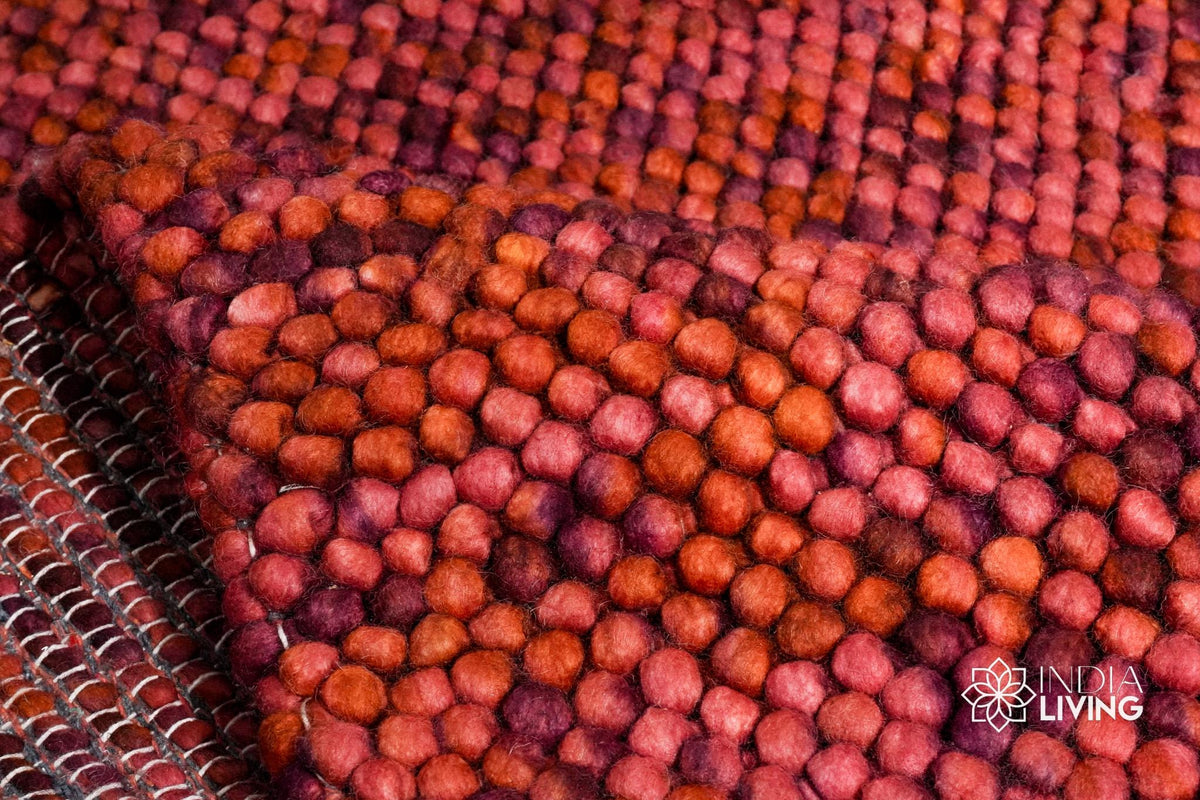 Terracotta wool rug edge and border detail