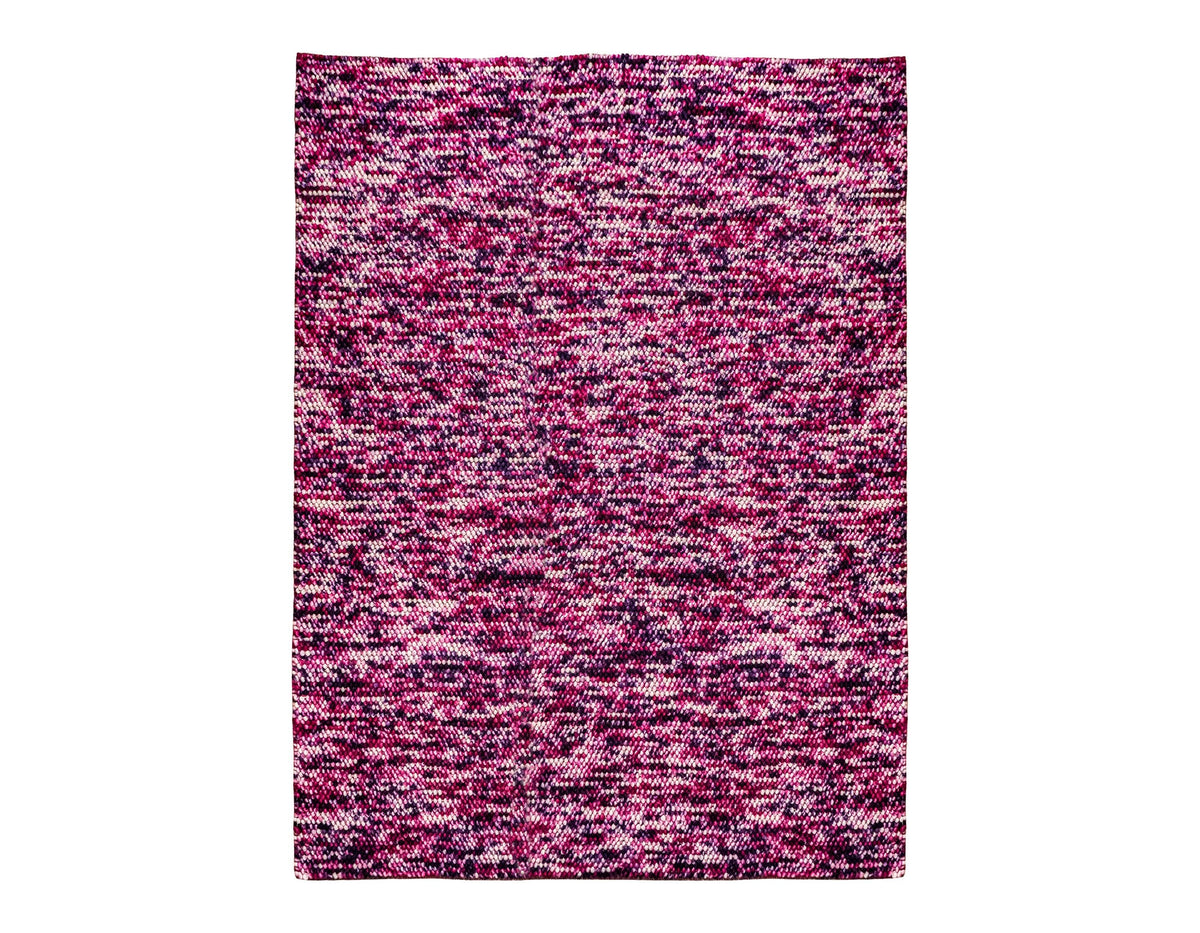 Purple wool rug corner detail showing reversible edge