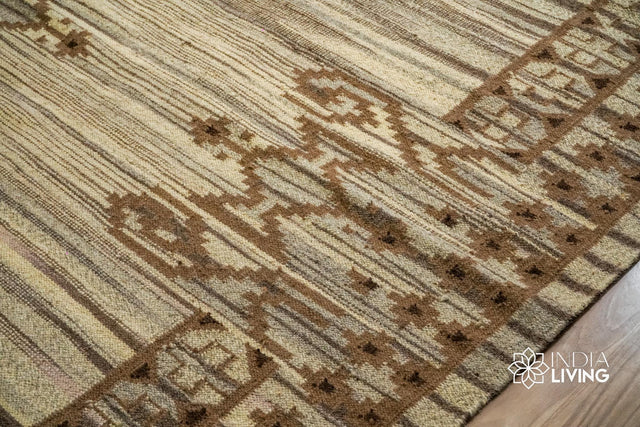 Beige kilim rug styled in a living room