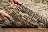 Corner view of beige wool kilim rug showing weave pattern