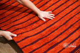 Red bohemian kilim rug geometric pattern close-up