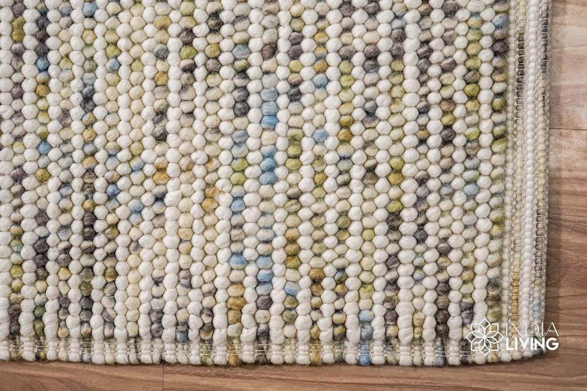 Pastel rug styled with playful kids room decor