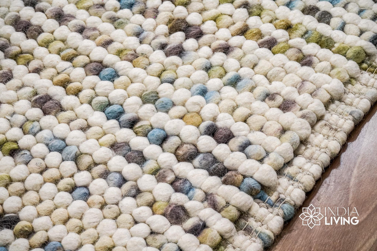 Pastel wool rug styled in a nursery room