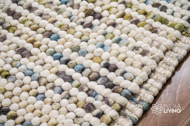 Pastel wool rug styled in a nursery room