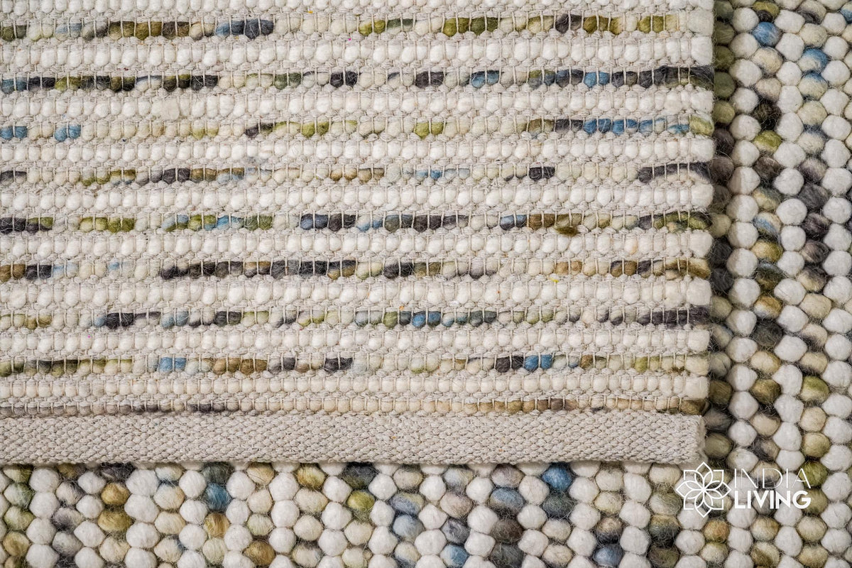 Colorful pastel loop rug detail showing multiple hues