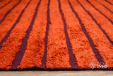 Red kilim rug corner detail showing flatweave edge