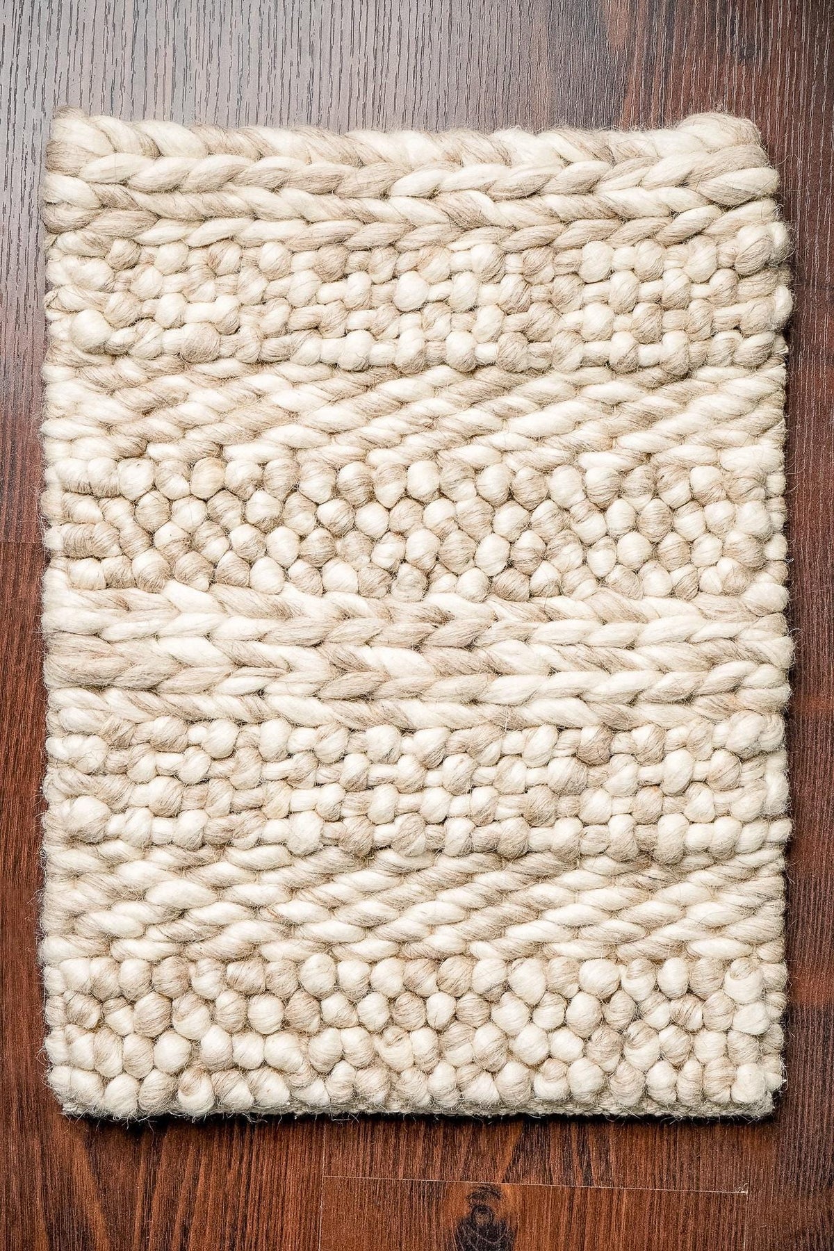 Multi patterned chunky wool rug, flat lay view