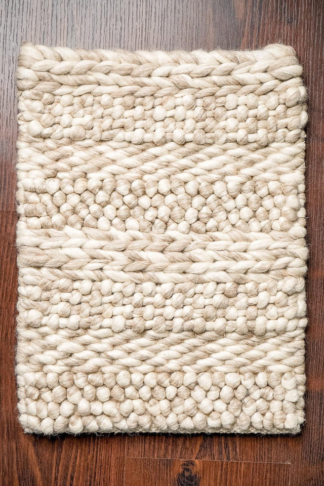 Multi patterned chunky wool rug, flat lay view