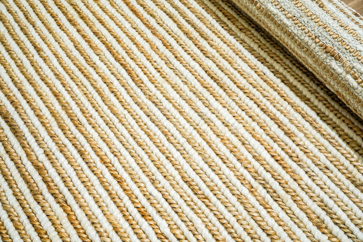 Wool jute braid rug styled in a Scandinavian living room