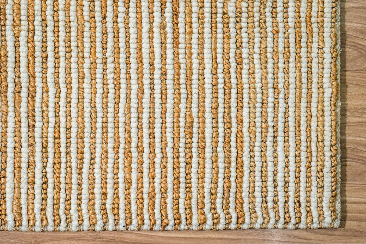 Overhead view of natural ivory wool jute rug on flooring