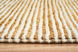 Natural ivory wool jute rug styled beside furniture