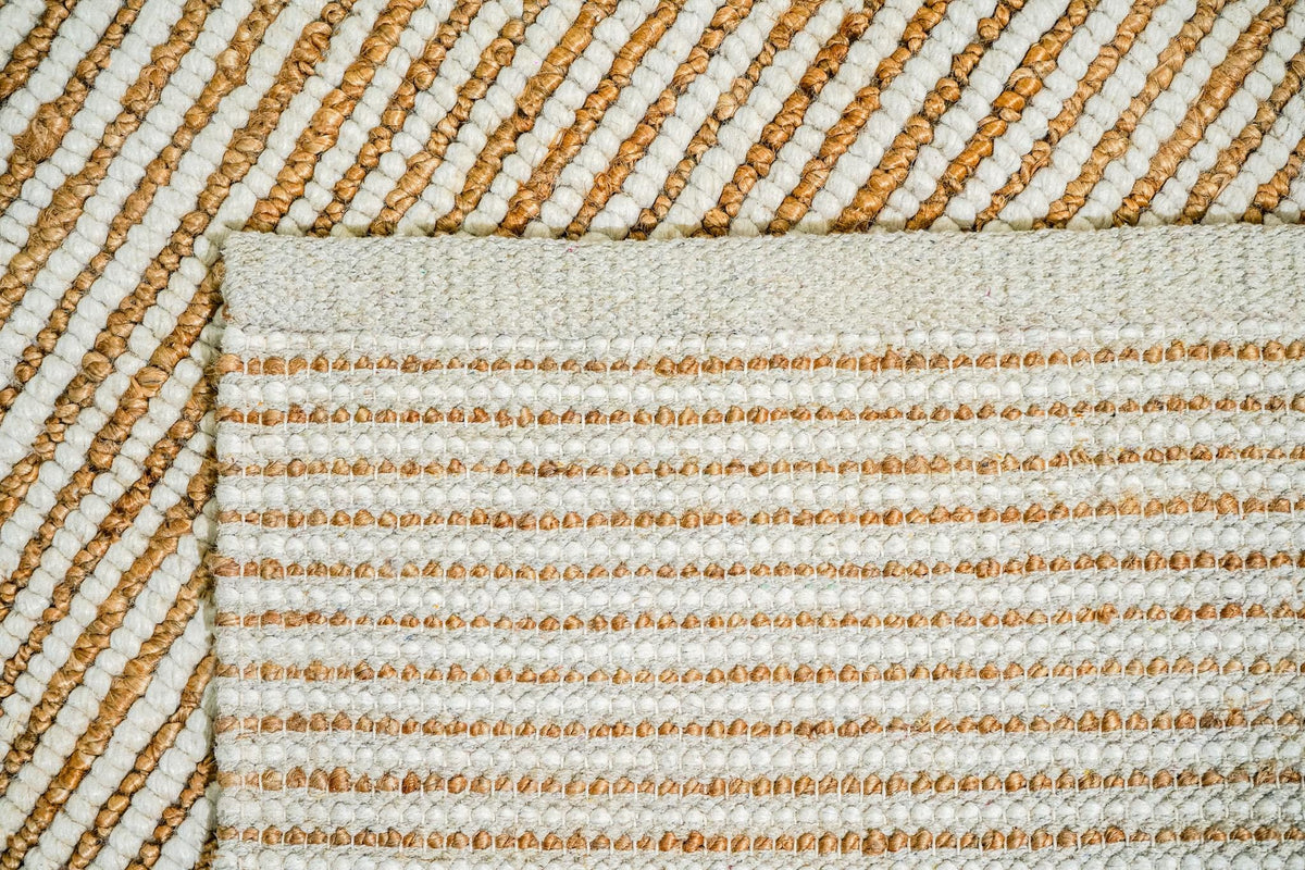 Natural ivory wool jute rug corner detail with stripe pattern