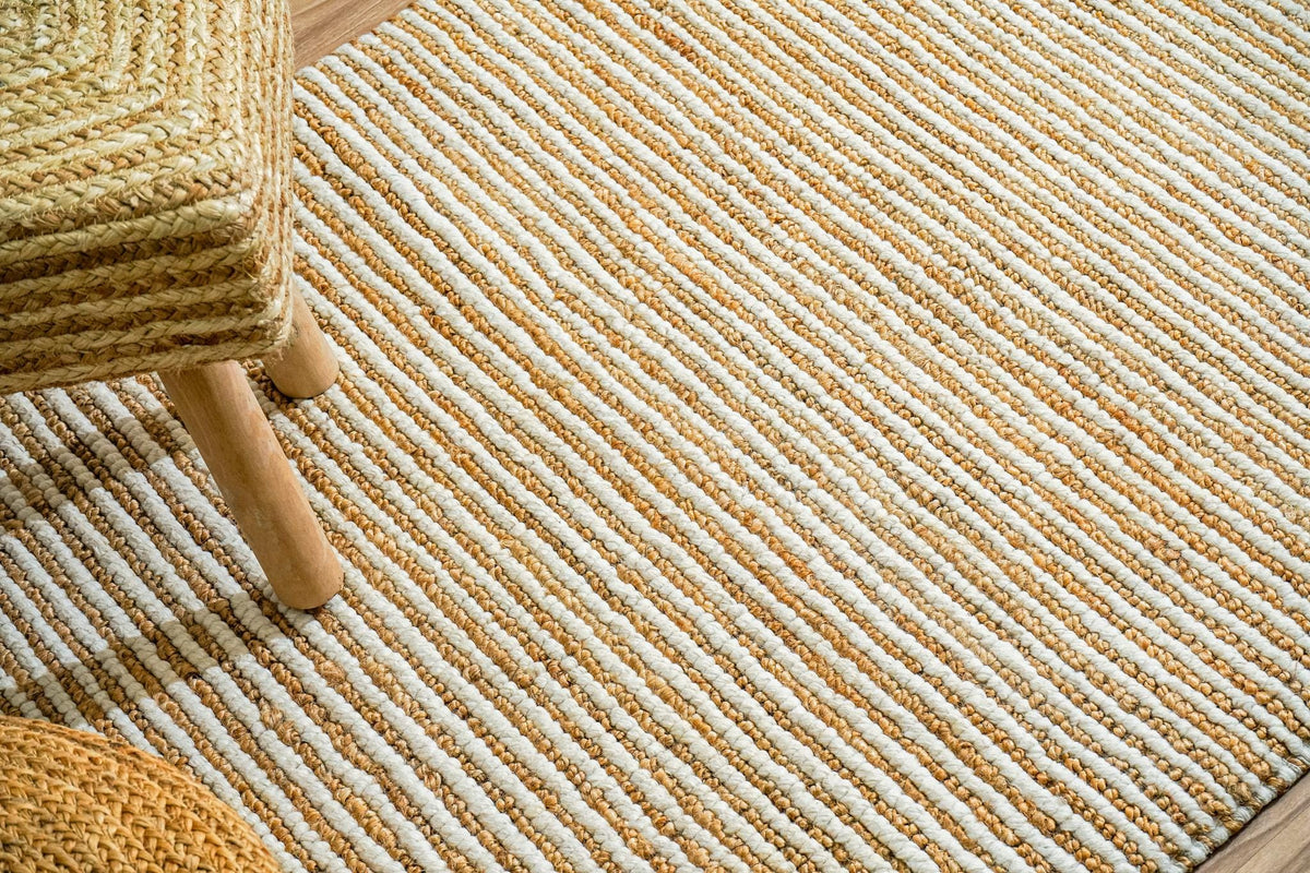 Natural ivory rug edge close-up highlighting stripe pattern