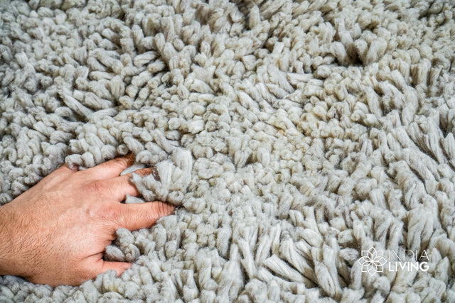 Taupe grey wool shag rug laid flat, full lush texture view