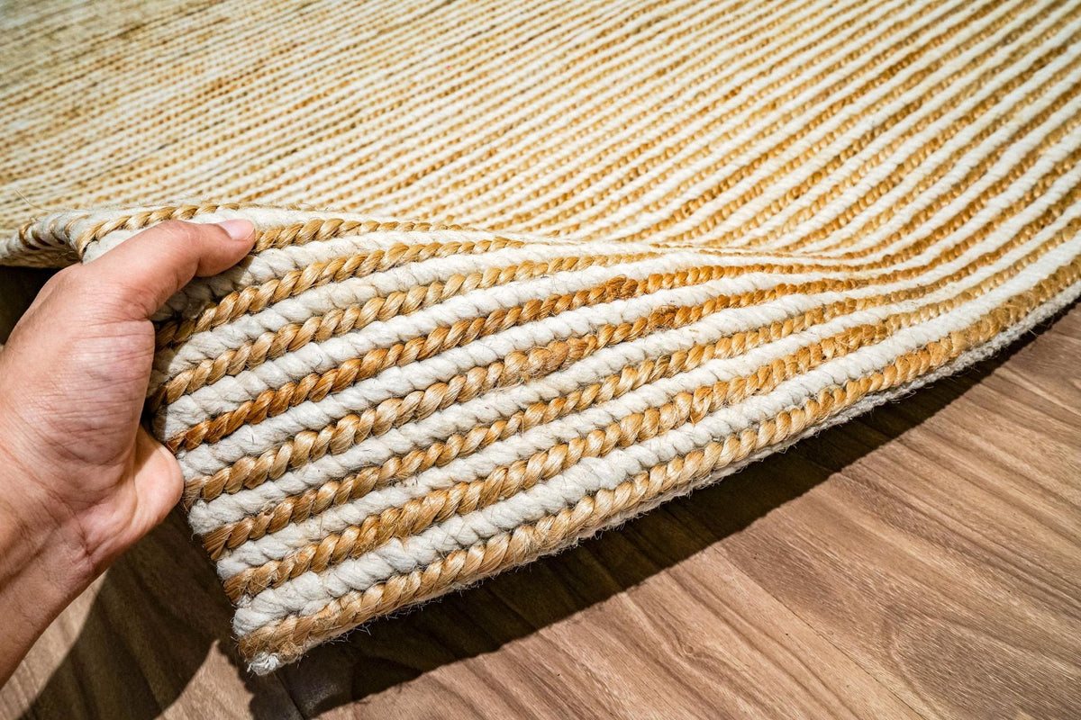 Natural ivory rug detail showing braided weave pattern