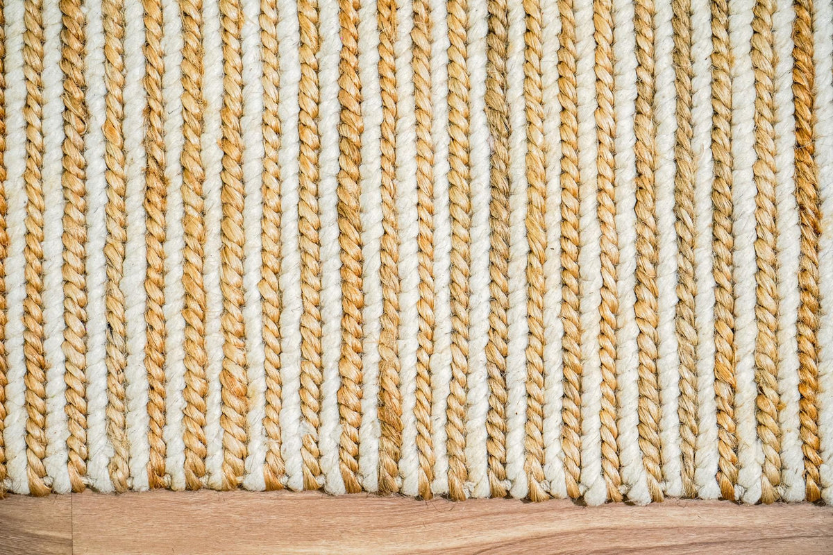 Braided edge detail of natural ivory jute rug